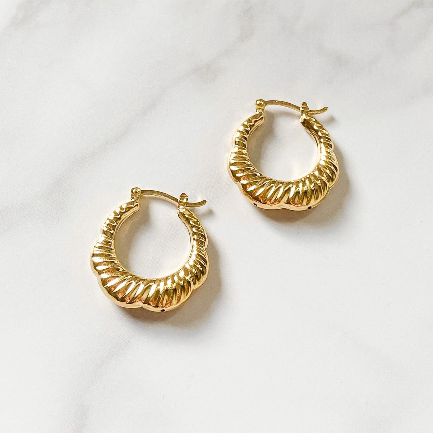 Croissant gold-filled hoops made in Brazil, hypoallergenic, water-resistants, and stylish, by ISVI Boutique Miami
