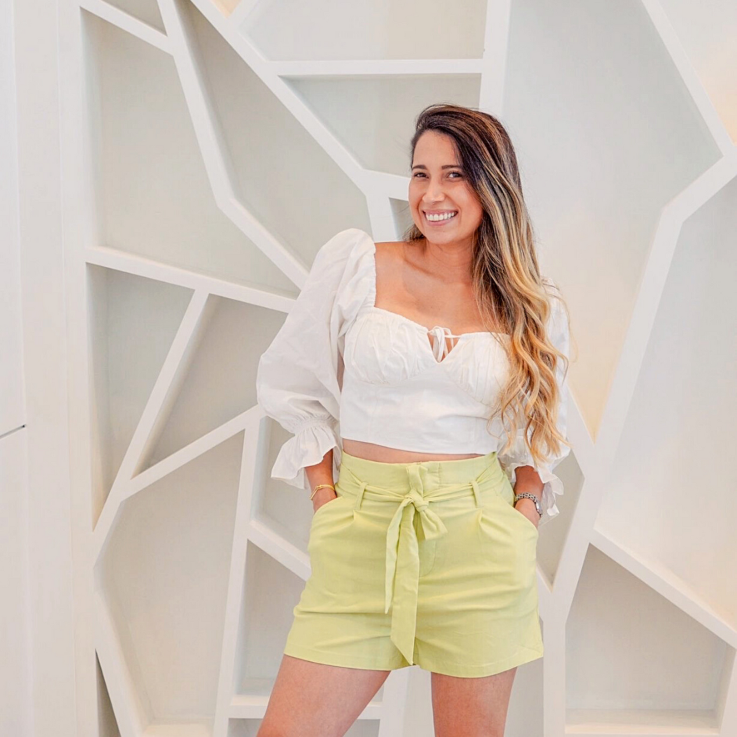 Jenni is wearing the White Bianca top and the Adella short in lemon color by ISVI Boutique Miami