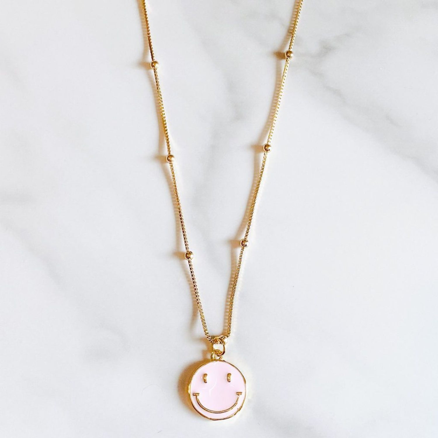Pink Happy Necklace with a gold-filled chain by ISVI Boutique, Miami