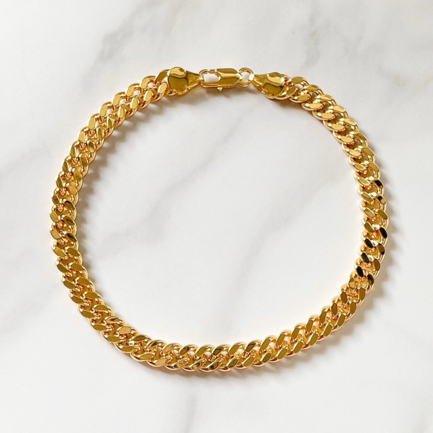 Lili Cuban Link gold-filled anklet (11") by ISVI Boutique Miami. Water-resistant and hypoallergenic. Matched with a pairs of white sneakers.