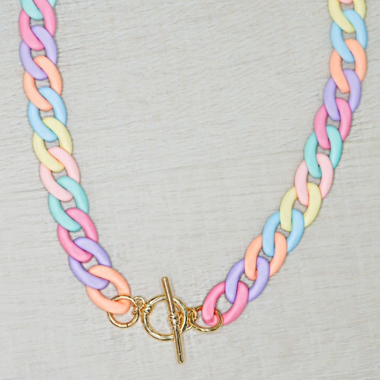 Multicolor spring choker handmade in acrylic in pastel color with gold-plated accessory by ISVI boutique Miami
