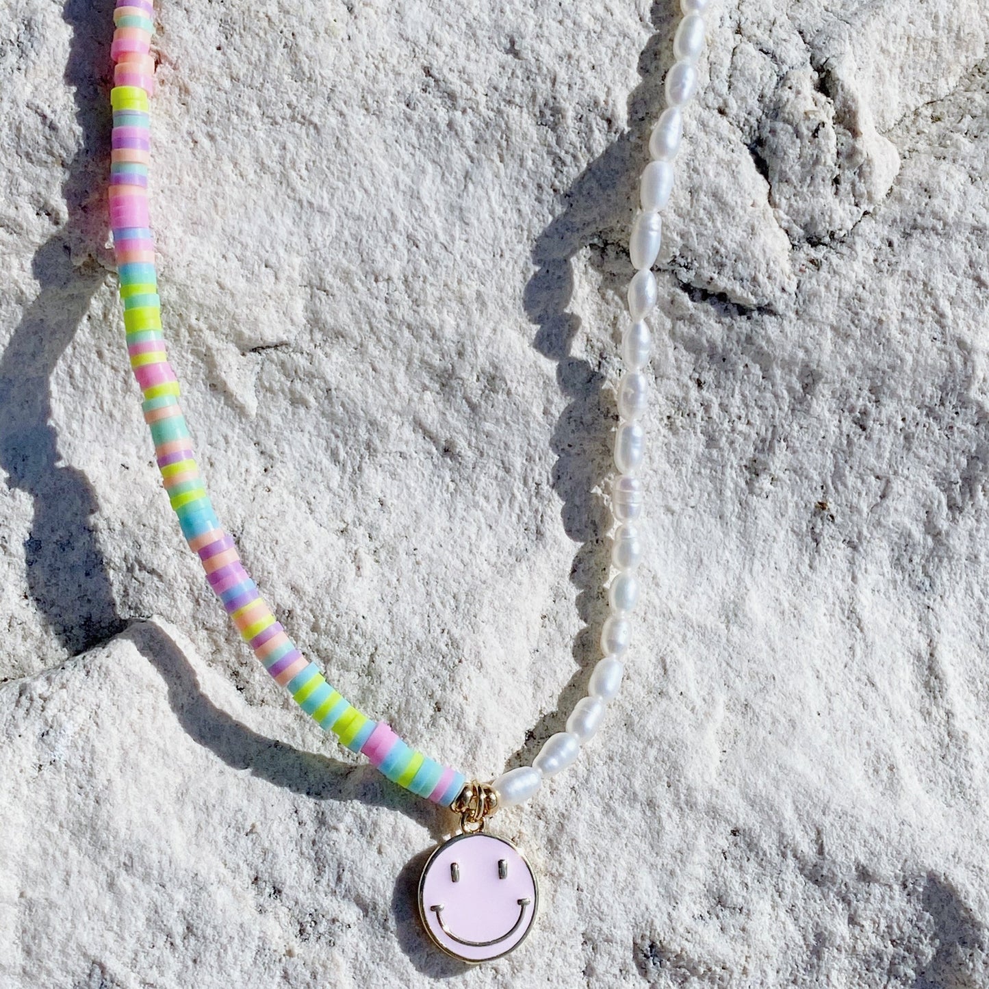 Puka pearls necklace over the sand beach by ISVI Boutique Miami